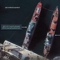 A satellite photo of Sevastapol harbor in the 克里米亚n peninsula, with two Russian tank landing ships ready for war (CSIS).